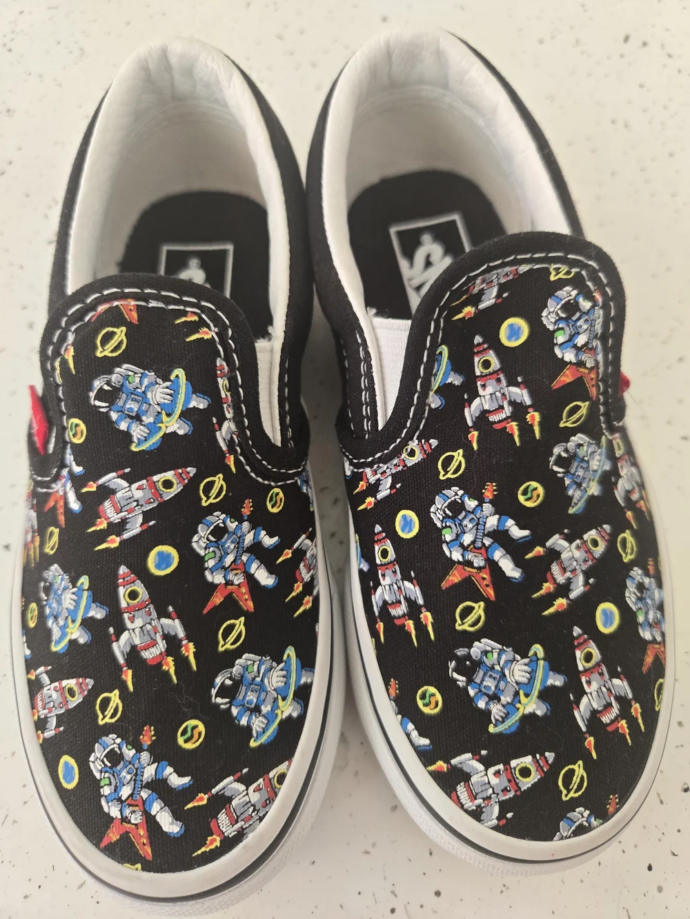 Vans Kids Slip-On Sneakers in Black with Multicolor Robot Print